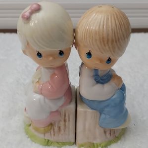Set of PRECIOUS MOMENTS salt and pepper shakers.